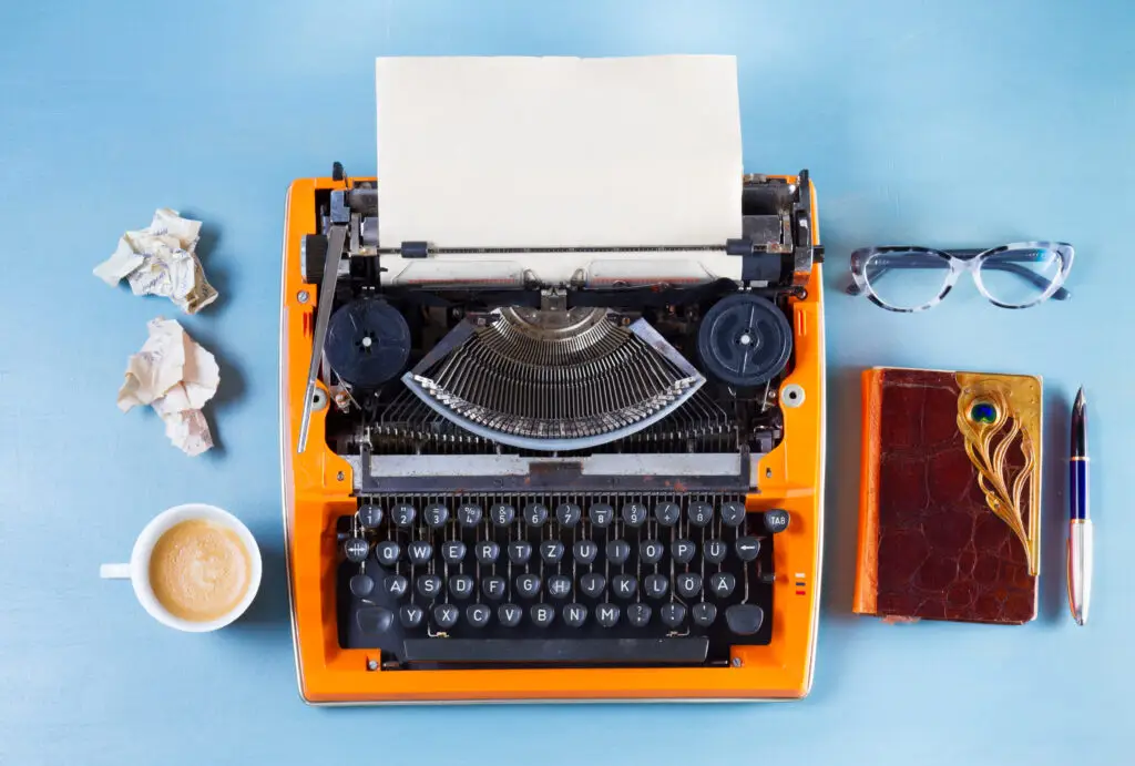 Workspace with vintage orange typewriter